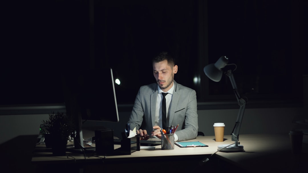 business man studying at desk night